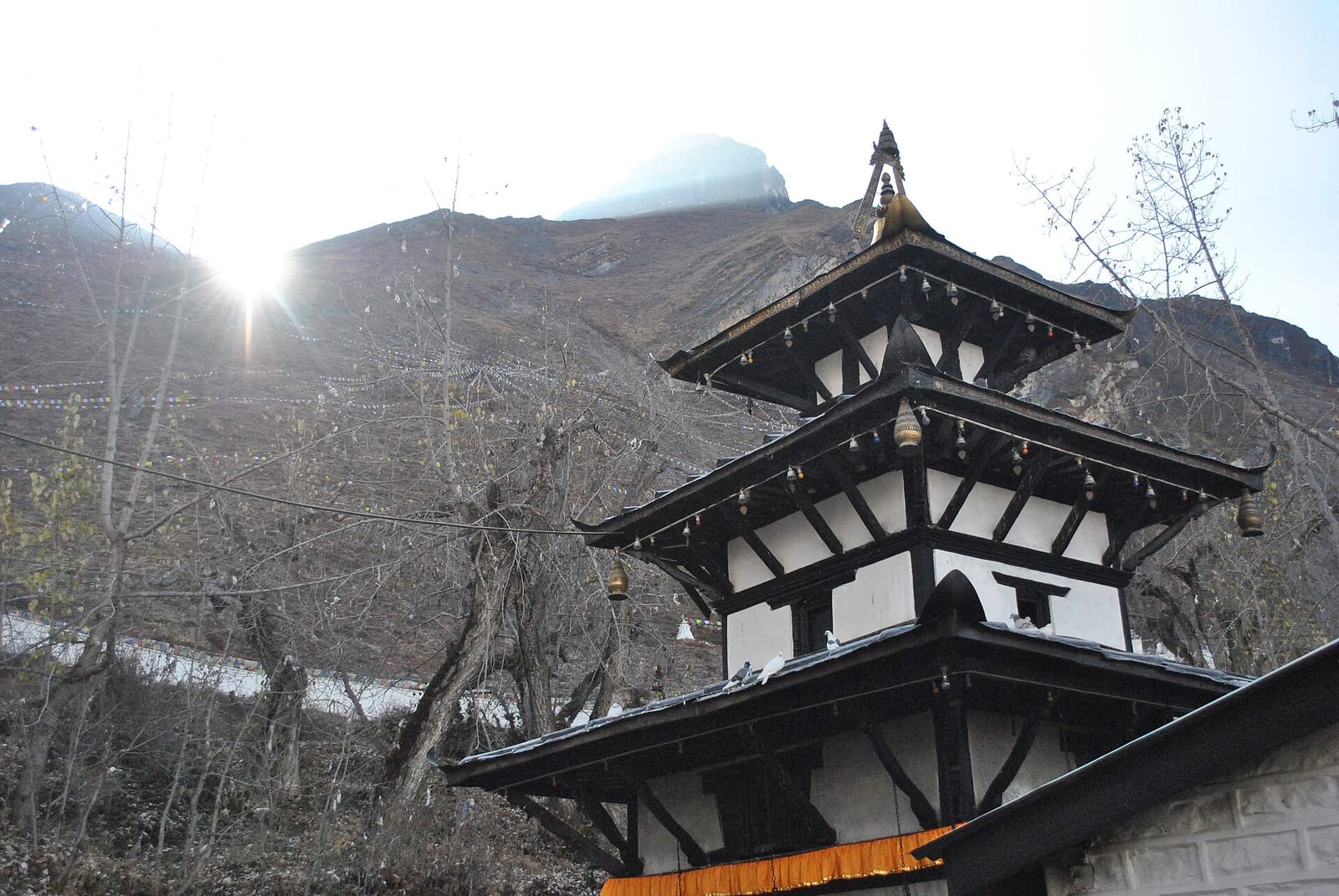 Sacred flame and snow at Muktinath Temple